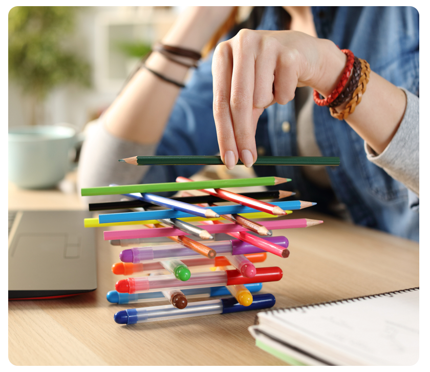 stack of pens and pencils