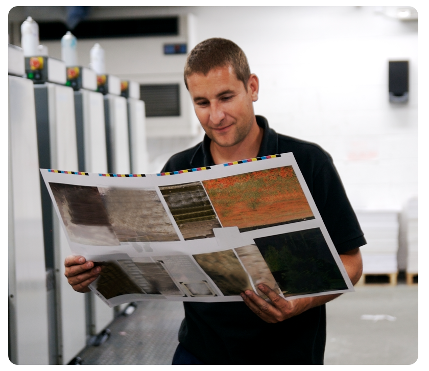 man holding printed sheet